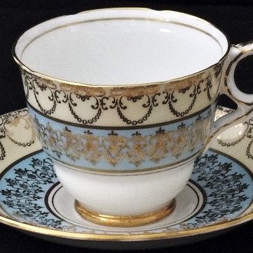 Cup - Taza Royal Stafford a set with cup and plate hand painted inlight brown and blue, with gold borders. Royal Stafford un juego de taza y plato pintados a mano en color...